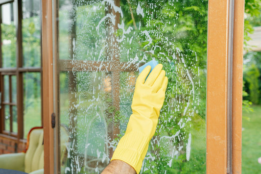 Window cleaning equipment beside a large glass surface
