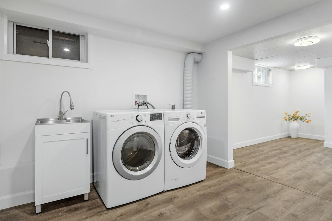 Bright laundry room with a front-load washer and clothes dryer