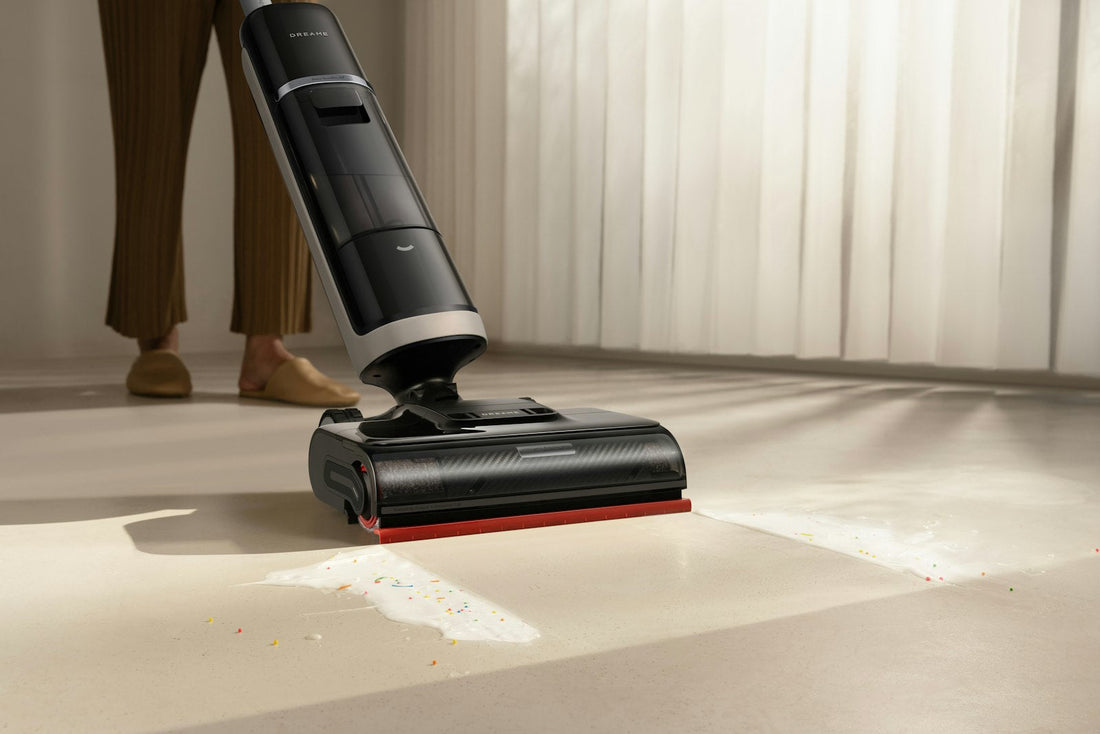 Person using a cordless vacuum cleaner on a clean hard floor