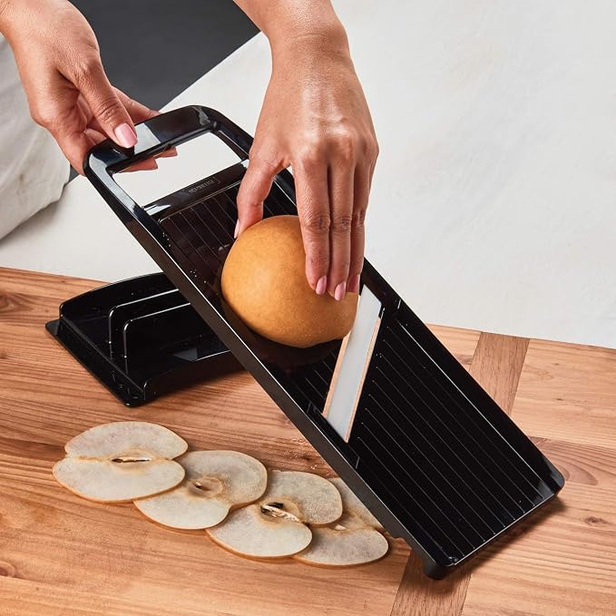Kyocera Advanced Ceramic Wide Adjustable Slicer with Handguard, Black | KYOCERA Wide Adjustable Mandoline Slicer: 4-Inch Angled Ceramic Blade, 4 Thickness Settings, and Secure Safety Handguard