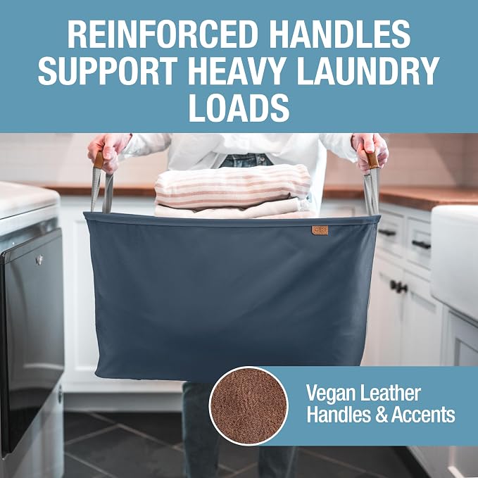 CleverMade LUXE Collapsible Laundry Basket, 60L, 2 Pack, Navy | Refined fabric and vegan leather accents elevate visible storage. Each basket supports 55 lb and folds flat.