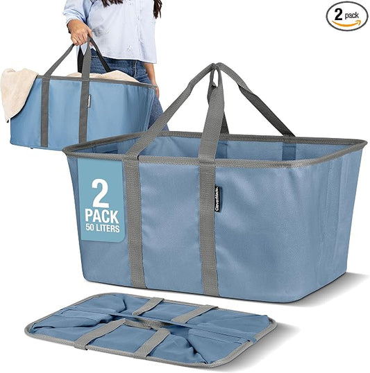 CleverMade Collapsible Laundry Tote, 50L, 2 Pack, Denim | Long center handles balance one-hand carrying. A steel rim supports 55 lb, then folds to 1.25 inches for compact storage.