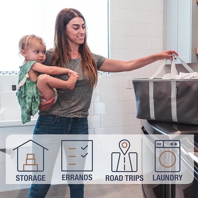CleverMade Collapsible Laundry Tote, 50L, 2 Pack, Charcoal | Long center handles balance one-hand carrying. A steel rim supports 55 lb, then folds to 1.25 inches for compact storage.